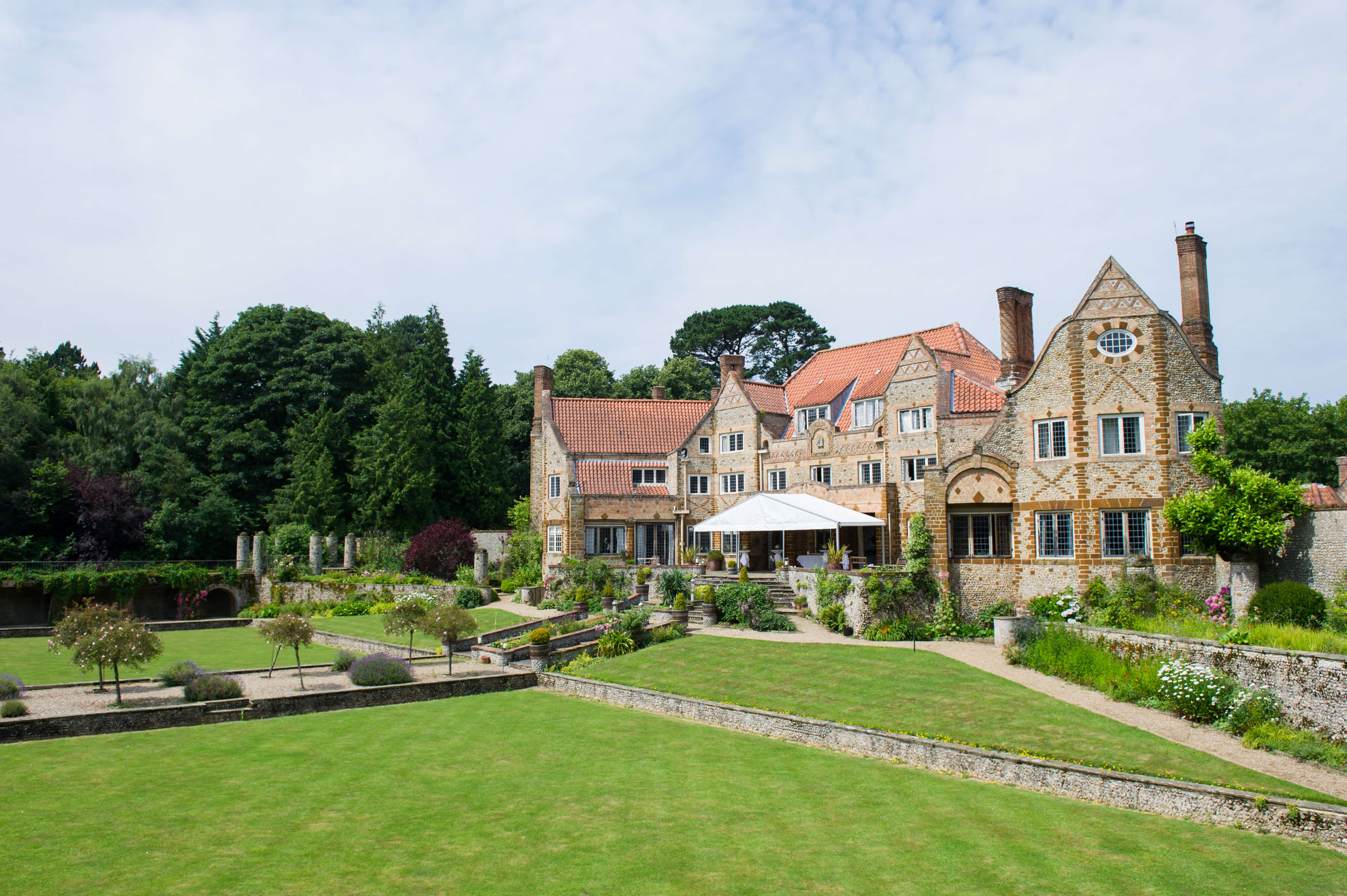 A exterior shot of Voewood, arts and crafts style house, in Welling in Norfolk